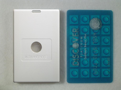 The jumboTag: a white tag the shape of a playing card, with a slot at the top and a round window, beside a credit card.