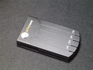 The Programming Station Reader: a black ActiveWave case with no antennas and four indicator lights along its front edge.
