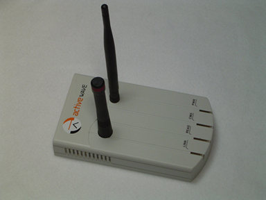 The Standard Reader: a light gray ActiveWave case with two black antennas and four indicator lights along its front edge.